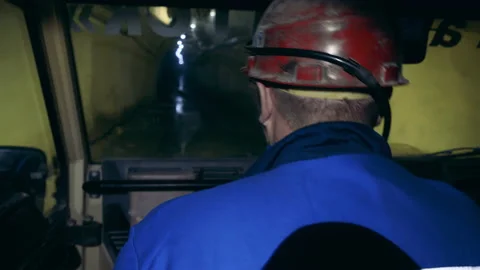 Backside view of a mine worker driving underground 動画素材 150818464