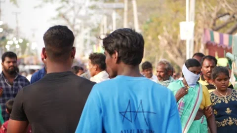 Backside view of people walking on road, View of people walking on Indian roads Vídeo Stock 150737445