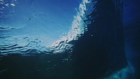 Backside view of strong ocean wave as it throws powerful lip of wave Stock Footage 280670754