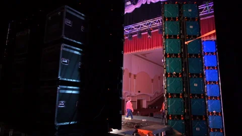 Backstage. Artists practice before the show. Bright lights flood the stage. Video stock 160652508