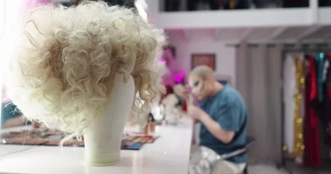Backstage, drag and wig with person getting ready for culture showcase or lgbt Stock Footage 314320760