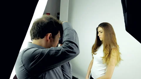 Backstage of photo session in studio with female model and photographer Stock Footage 61767904