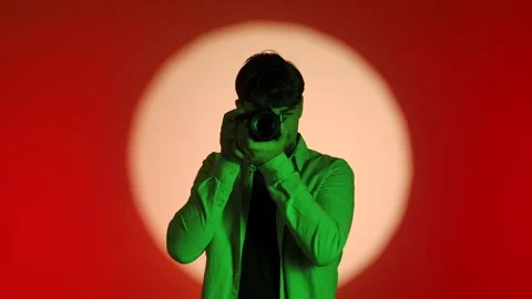 Backstage Photographer Capturing Image with Creative Lighting Setup Stock Footage 334108317