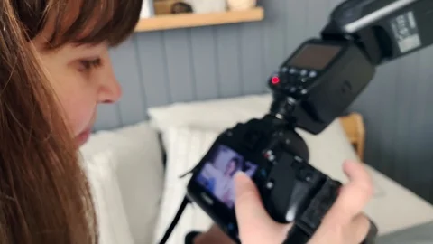 Backstage Of Photoshoot. Back view. Close up female. Young girl makes photo. Stock Footage 125933907