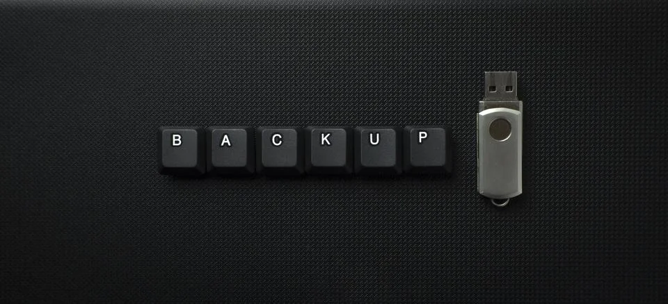 Backup Data Concept With USB Drive On Dark Textured Background Stock Photos