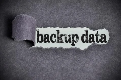 Backup data word under torn black sugar paper Stock Photos