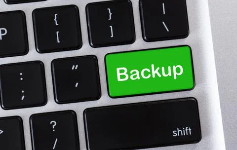 Backup green button on computer keyboard, closeup Stock Photos