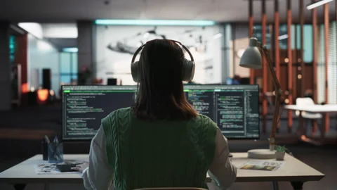 Backview Female Programmer Coding In Gamedev Office Video stock 255796392
