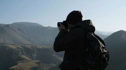 Backview: one guy make a pic of beautiful natural scene of national park use the Stock Footage 199493219