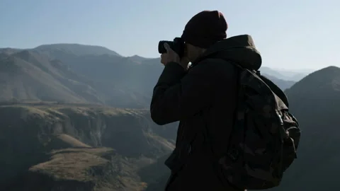 Backview: one guy make a pic of scenic area morning fog highlands use the optica Stock Footage 201097306