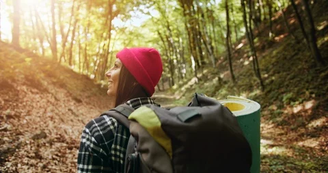 Backview of Woman with Backpack in Forest 動画素材 115287475