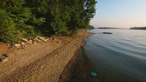 Backward aerial view over the riverside Stock Footage 70760236