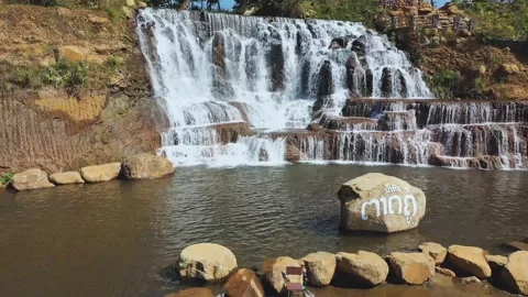 Backward aerial view of Tad Koo waterfall in Bolaven Plateau, Laos Stock Footage 248094485