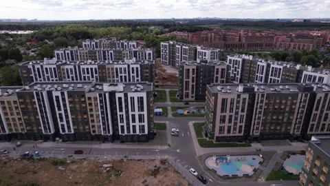 Backward and upward drone flight above Rafinad housing blocks Stock Footage 329576630
