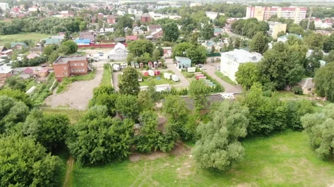 Backward drone ascent over Kolomna cityscape and river Stock Footage 333952221