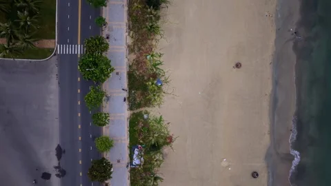 Backward drone flight over beach and coastal road in Da Nang, Vietnam Vídeo Stock 340597586