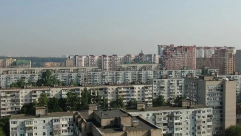 Backward drone flight over layered residential cityscape Stock Footage 324246612