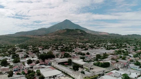 Backward drone flight over San Vicente town in Central America Stock Footage 101469973