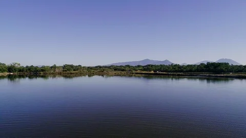 Backward drone flight over shrimp fishermen in Central America Stock Footage 101028797
