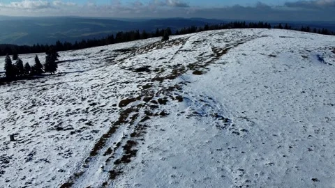 Backward Drone Flight Over Snowy Creux du Van Hills Video stock 303746843