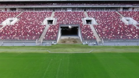 Backward drone flight revealing stadium field and stands Vidéo 322933546