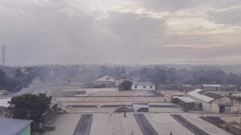 Backward Drone Flight Reveals Rice Processing at Khajanagar Rice Mill Yard Stock-Footage 346218786