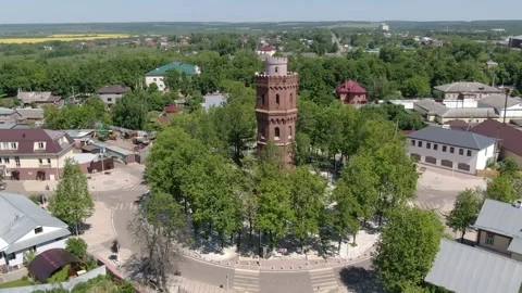 Backward drone movement revealing tower and cityscape Stock Footage 333484598