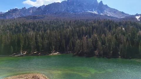 Backward Drone Pullout From Dolomite Massif Across Misurina Lake Shoreli Stock Footage 340121040