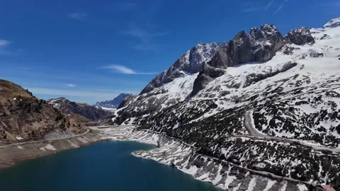 Backward Drone Pullout From Marmolada Mountain Walls Over Lago di Fedaia Video stock 339791251