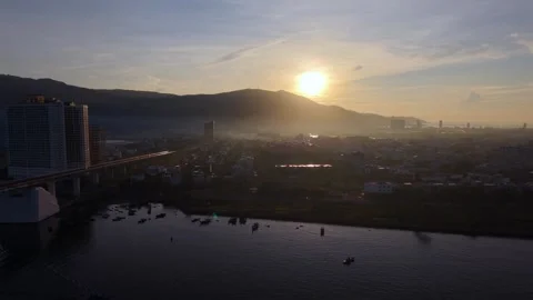 Backward drone reveal of Thuan Phuoc Bridge at sunrise in Da Nang, Vietnam Stock Footage 340874563