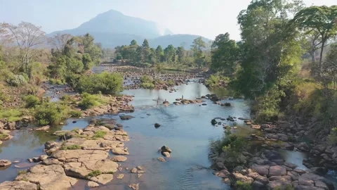 Backward drone shot of Tad Lo waterfall in Boloven Plateau, Laos Stock Footage 247865473