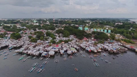 Backward Flight Over Coastal Stilt Village Puerto Princesa Bay Video stock 332961343