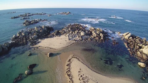 Backward flight over a coastal tip on Atlantic ocean. HD complete version Stock Footage 86476668