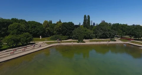 Backward Flight Over Park Pond Stock Footage 91257100