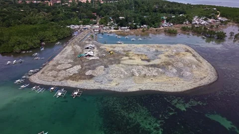 Backward Flight Over Stone Reclamation Berm Puerto Princesa Palawan 스톡 동영상 332989401