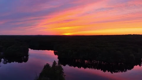 Backward high angle drone view during a stunning sunset at Harold Parker State Stock Footage 337125662