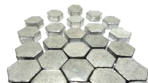 Backward moving view of metal hexagons that become more tightly packed together. Vidéo 331229918