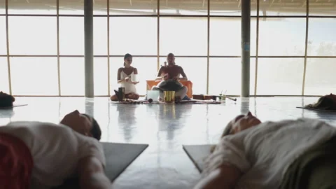 Backward shot of therapy group session listening to the relaxing sounds of Video stock 217442423