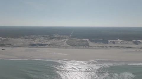 Backward tracking beach facing shoreline Video stock 345220619