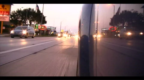 Backward view city street driving Stock Footage