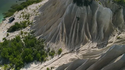Backwards 4k drone video shot of sand dunes formed by wind. Stock Footage 224525113