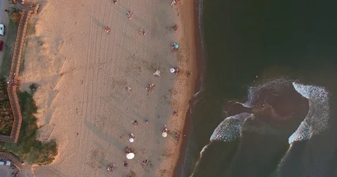 Backwards Aerial Pan of Beach Stock Footage 72934239
