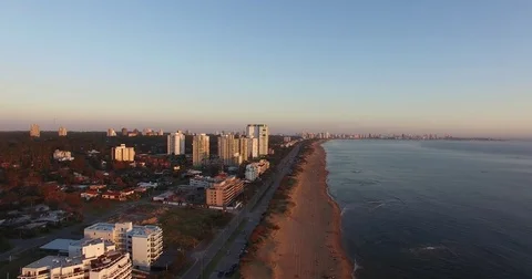 Backwards Aerial Pan of Sunset Beach Stock Footage 72932657