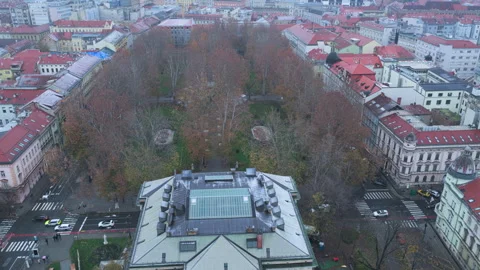 Backwards drone flight over HAZU building and Zrinjevac park in snowy Zagreb Stock Footage 321647261