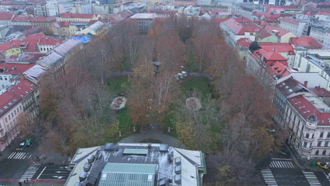 Backwards drone flight over HAZU building and Zrinjevac park in snowy Zagreb Stock Footage 321649552