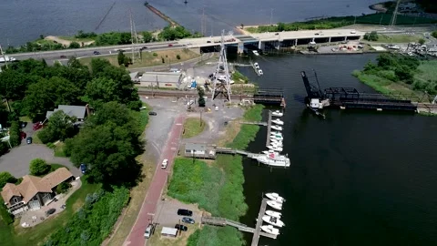 Backwards flight over a marina in Morgan, NJ Stock Footage 135282981