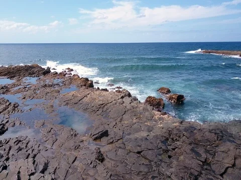 Backwards Flight over Rocks Stock Footage 76448865