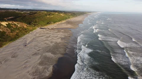 Backwards Flying Along Coast with Waves Breaking on Empty Wide Sandy Beach 库存影片 226221868