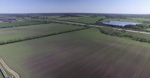 Backwards flying over rapefields_DJI 0005 3 Video stock 76518844