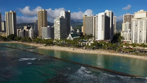 Backwards Moving aerial shot, View offshore of Waikiki Beach Hawaii. Stock Footage 128295667